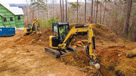 trenching with a mini excavator|digging footings with mini excavator.